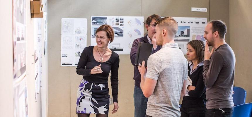 group of graduate students around architecture project